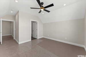 Bonus room featuring lofted ceiling and ceiling fan