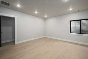 Spare room with light wood-type flooring