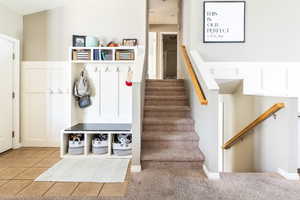 Mudroom featuring light tile patterned floors