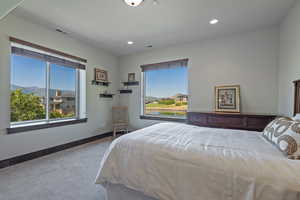 Bedroom with a mountain view and carpet floors