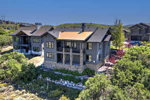 Rear view of house featuring a balcony