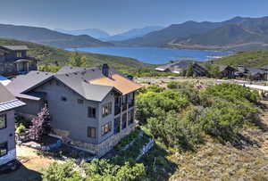 Property view of mountains with a water view