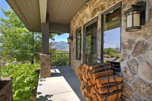 View of patio / terrace featuring a porch and a mountain view