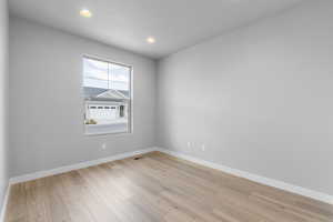 Empty room featuring light hardwood / wood-style flooring