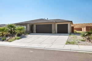 View of front of property featuring a garage