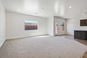 Unfurnished living room with light wood-type flooring