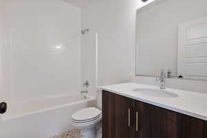 Full bathroom featuring vanity, toilet, and shower / bathing tub combination