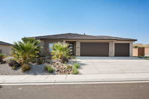 Prairie-style house featuring a garage