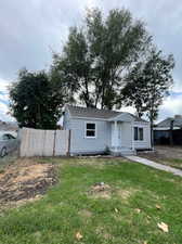 View of front of property with a front yard