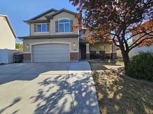 View of front of property with a garage