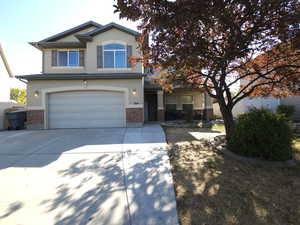 View of front of home with a garage