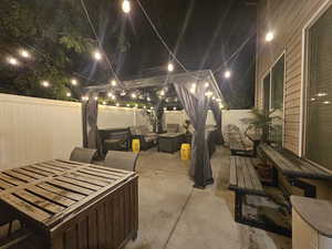 View of patio / terrace featuring an outdoor living space with a fire pit