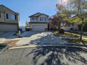 Front of property with a garage