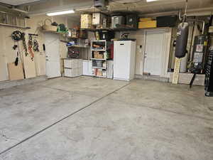 Garage with a garage door opener and water heater