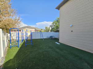 View of yard with a playground