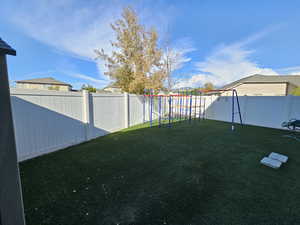 View of yard featuring a playground