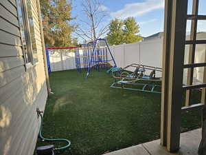 View of yard with a playground