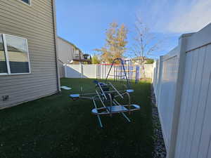 View of yard featuring a playground