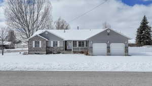 Single story home featuring an attached garage