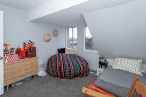 Bedroom with carpet floors and a textured ceiling