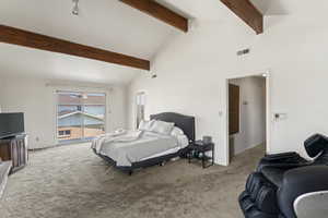 Bedroom featuring beamed ceiling, high vaulted ceiling, and light carpet