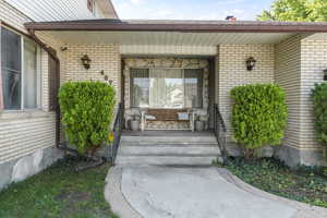 Property entrance with a porch