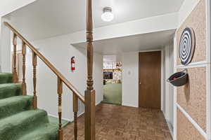 Corridor featuring parquet floors