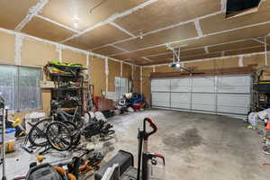 Garage featuring a garage door opener