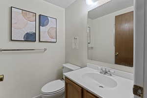 Bathroom featuring vanity and toilet