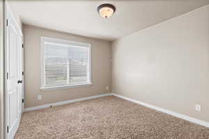 Unfurnished bedroom featuring carpet