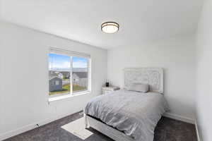 Bedroom featuring carpet