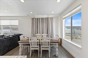 Dining space featuring wood-type flooring