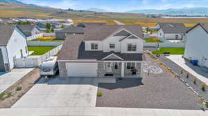 View of front of house featuring a garage and a mountain view