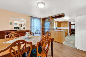 Dining space featuring light hardwood / wood-style flooring