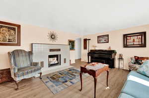 Living room with light hardwood / wood-style flooring