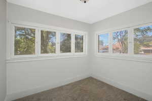 Empty room with carpet flooring