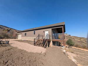 Back of house featuring a garage