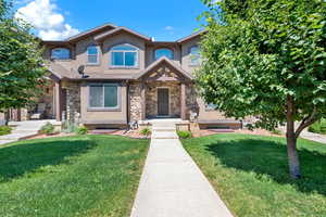 View of front of property with a front yard