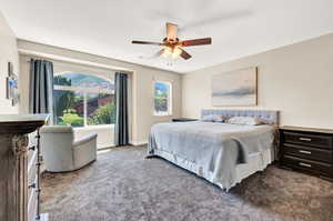 Bedroom featuring carpet and ceiling fan