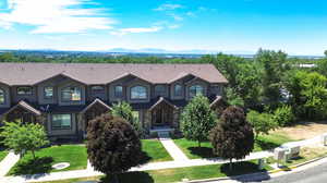 View of front of property featuring a front lawn and a mountain view