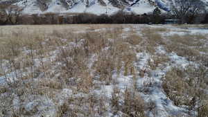 View of snow covered land with a mountain view