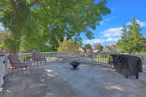 View of patio featuring a fire pit