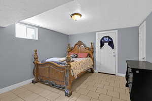 Bedroom with a textured ceiling