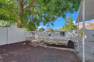 View of yard with a wooden deck