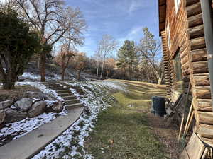 View of yard layered in snow