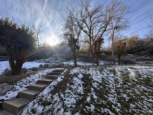 View of yard layered in snow