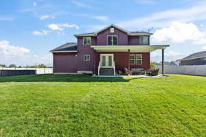 View of front of home featuring a front lawn, a patio, and an outdoor hangout area