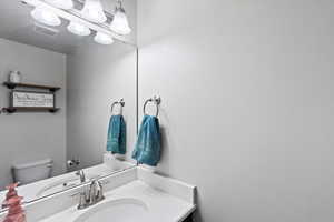 Bathroom featuring toilet and vanity