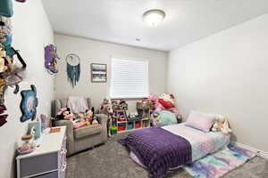 Bedroom featuring carpet flooring