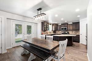 Dining space featuring light wood-type flooring and french doors